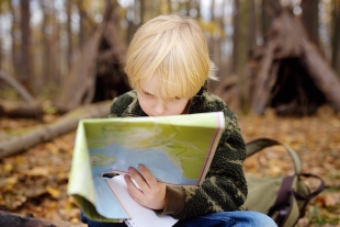 Child reading a map